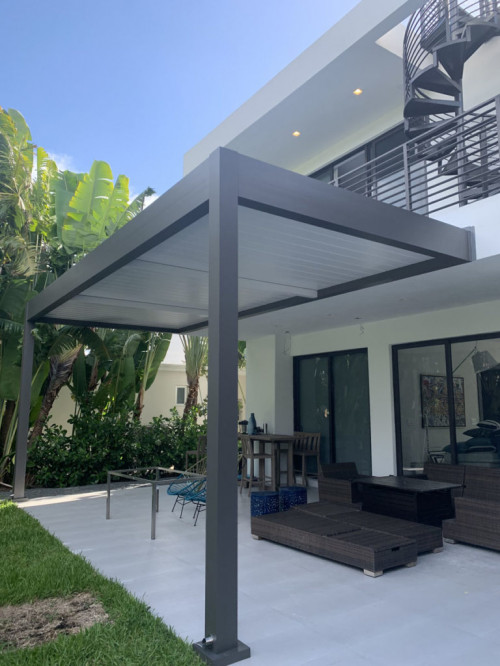 grey and white louvered pergolas attached to the house 03 768x1024 1